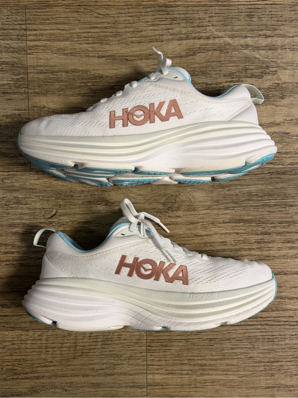 Hoka Women’s 9W White Sneakers with Rose Gold Logo and Light Blue Trim